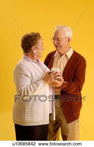 Stock Image - Senior couple posing; Canada, Saskatchewan, Regina. Fotosearch