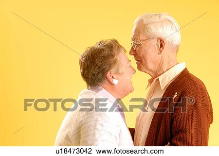 Stock Image - Senior couple posing; Canada, Saskatchewan, Regina. Fotosearch