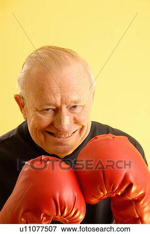 Senior male boxing gloves; Canada, Saskatchewan, Regina View Large Photo Image Stock Photo - Senior male boxing gloves; Canada, Saskatchewan, Regina. Fotosearch