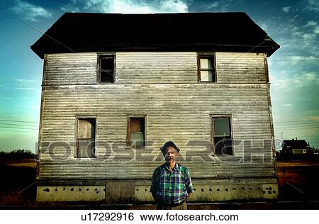 Senior man in front of derelict house, Robsart, Saskatchewan, Canada View Large Photo Image Stock Photograph - Senior man in front of derelict house, Robsart, Saskatchewan, Canada. Fotosearch