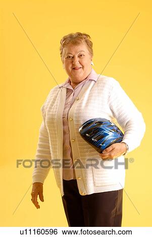 Senior Woman bicycle helmet; Canada, Saskatchewan, Regina View Large Photo Image Stock Photograph - Senior Woman bicycle helmet; Canada, Saskatchewan, Regina. Fotosearch
