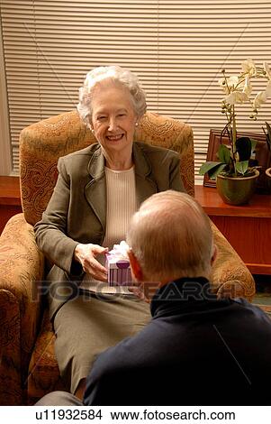 Picture - Senior Woman in Armchair; Canada, Saskatchewan, Regina. Fotosearch
