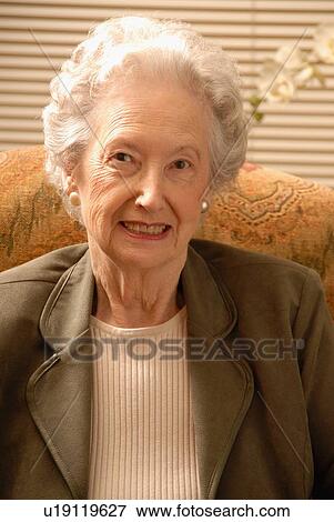 Stock Photo - Senior Woman in Armchair, Regina, Saskatchewan. Fotosearch