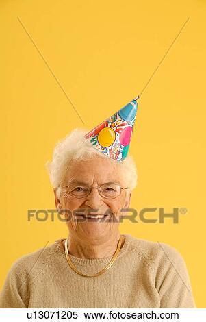 Senior Woman party hat; Canada, Saskatchewan, Regina View Large Photo Image Stock Photography - Senior Woman party hat; Canada, Saskatchewan, Regina. Fotosearch