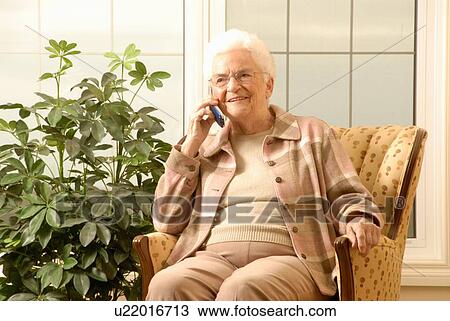 Stock Image - Senior Woman with cell phone, Regina, Saskatchewan. Fotosearch