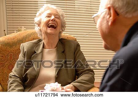 Senior Woman with gift, Regina, Saskatchewan View Large Photo Image Picture - Senior Woman with gift, Regina, Saskatchewan. Fotosearch