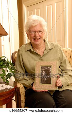 Senior Woman with picture; Canada, Saskatchewan, Regina View Large Photo Image Stock Photo - Senior Woman with picture; Canada, Saskatchewan, Regina. Fotosearch