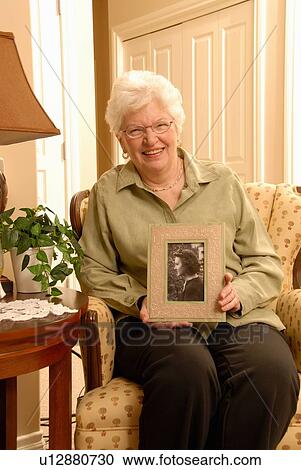 Senior Woman with picture, Regina, Sasktachewan View Large Photo Image Stock Image - Senior Woman with picture, Regina, Sasktachewan. Fotosearch