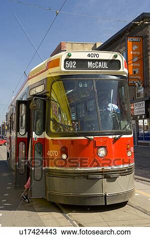 Stock Image - Electric Streetcar, Toronto Transit System, no carbon emissions; Canada, Ontario, Toronto. Fotosearch