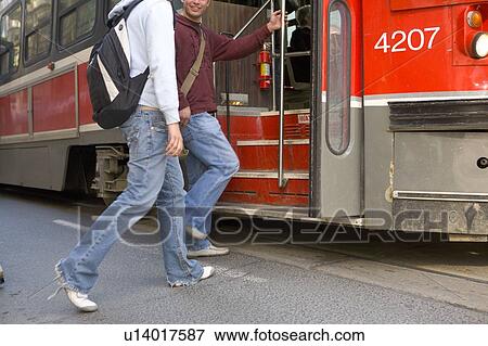 Passengers getting on electric Streetcar, Toronto Transit System, no carbon emissions; Canada, Ontario, Toronto View Large Photo Image Stock Photo - Passengers getting on electric Streetcar, Toronto Transit System, no carbon emissions; Canada, Ontario, Toronto. Fotosearch