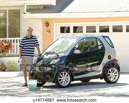 Teenage boy washing smart car, Regina, Saskatchewan View Large Photo Image Stock Photo - Teenage boy washing smart car, Regina, Saskatchewan. Fotosearch