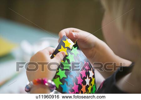 Stock Photograph - 3 year old and stickers, B. C.. Fotosearch