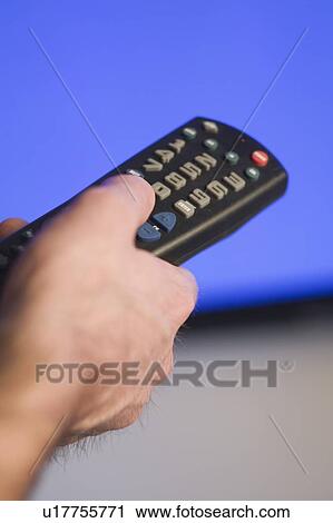 Stock Image - Channel changer and plasma TV, B. C.. Fotosearch