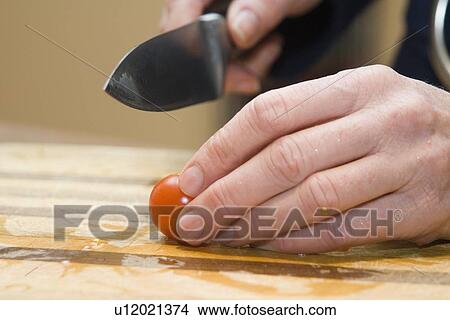 Cutting tomato View Large Photo Image Picture - Cutting tomato. Fotosearch
