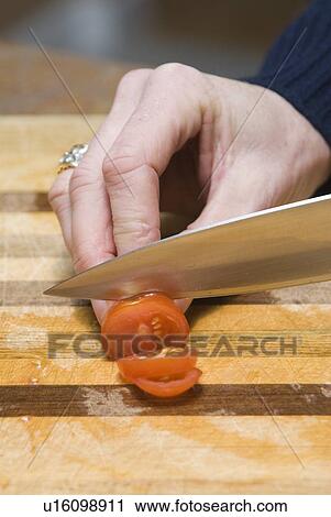 Cutting tomato View Large Photo Image Stock Image - Cutting tomato. Fotosearch