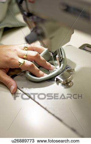 Detail of hand sewing fabric on a sewing machine, Canada, Ontario View Large Photo Image Stock Image - Detail of hand sewing fabric on a sewing machine, Canada, Ontario. Fotosearch