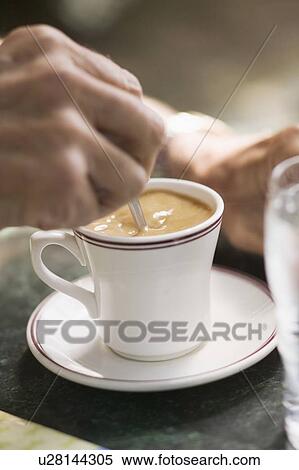 Stock Photography - Senior caucasian male hands and coffee, B. C.. Fotosearch