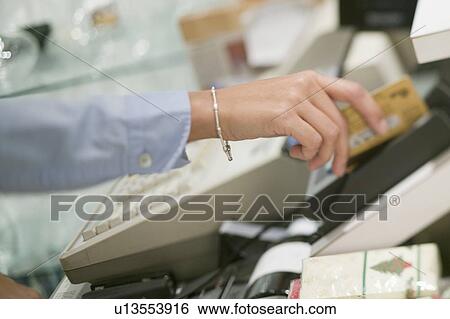 Stock Photograph - Swiping credit/debit card, Vancouver, B. C.. Fotosearch