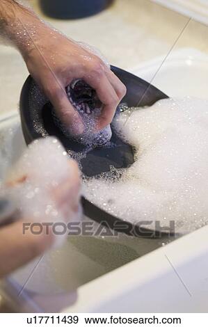 Stock Photo - Washing dishes, West Vancouver, B. C.. Fotosearch