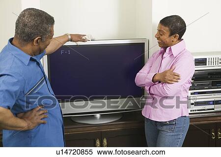 African American couple installing a flat screen TV, Vancouver, BC View Large Photo Image Stock Photography - African American couple installing a flat screen TV, Vancouver, BC. Fotosearch