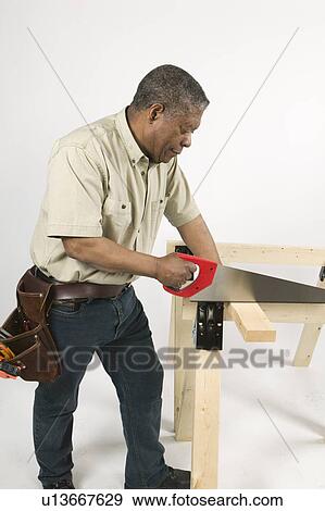 African American Man Doing Home Improvement, Canada, British Columbia View Large Photo Image Stock Photo - African American Man Doing Home Improvement, Canada, British Columbia. Fotosearch