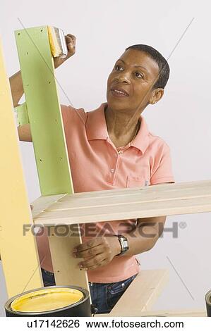 African American Woman Doing Home Improvement Painting, Canada, British Columbia View Large Photo Image Stock Photograph - African American Woman Doing Home Improvement Painting, Canada, British Columbia. Fotosearch
