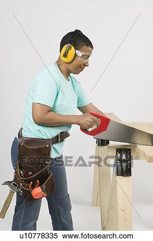 African American Woman Doing Home Improvement, Cutting Lumber With a Hand Saw, Vancouver, BC View Large Photo Image Stock Photography - African American Woman Doing Home Improvement, Cutting Lumber With a Hand Saw, Vancouver, BC. Fotosearch