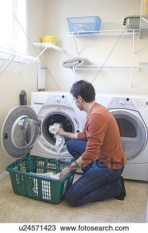 Man loading front loading washing machine with cloth diapers, Winnipeg, Canada View Large Photo Image Stock Image - Man loading front loading washing machine with cloth diapers, Winnipeg, Canada. Fotosearch