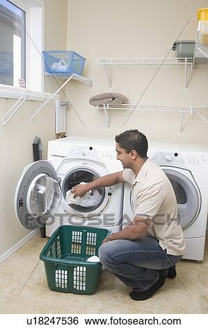 Man loading front loading washing machine with cloth diapers, Winnipeg, Canada View Large Photo Image Stock Photograph - Man loading front loading washing machine with cloth diapers, Winnipeg, Canada. Fotosearch