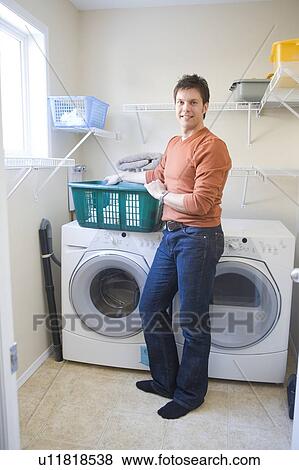 Man stands in front of front loading washing machine with cloth diapers, Winnipeg, Canada View Large Photo Image Stock Photo - Man stands in front of front loading washing machine with cloth diapers, Winnipeg, Canada. Fotosearch