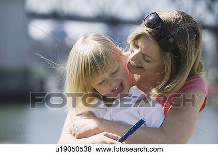 Caucasian Mom and 4 year old Daughter. Sunset Beach, Vancouver, BC View Large Photo Image Stock Photo - Caucasian Mom and 4 year old Daughter. Sunset Beach, Vancouver, BC. Fotosearch