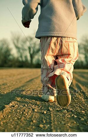 Child running on bare ground, Saskatchewan, Canada View Large Photo Image Stock Image - Child running on bare ground, Saskatchewan, Canada. Fotosearch