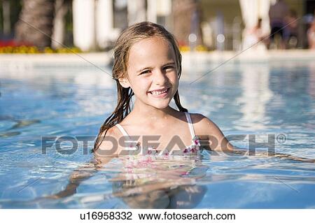Stock Image - Girl - (5) swimming in a pool, Jacksonville, Florida. Fotosearch