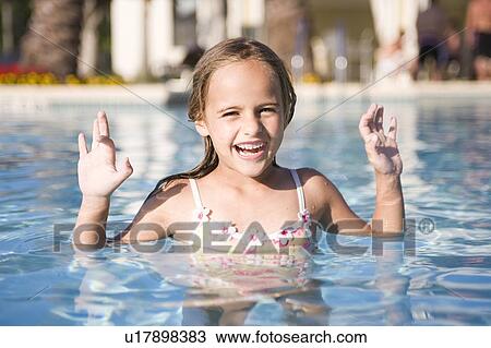 Stock Image - Girl - (5) swimming in a pool, Jacksonville, Florida. Fotosearch
