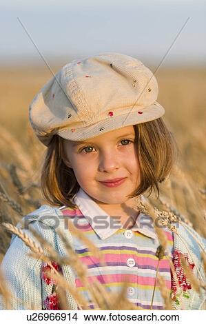 Picture - Girl - 5 years old in the field, Manitoba, Canada. Fotosearch