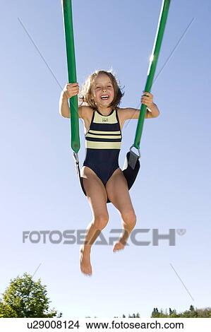 Girl - 6 years old on the swing in the park, Winnipeg, Canada View Large Photo Image Picture - Girl - 6 years old on the swing in the park, Winnipeg, Canada. Fotosearch
