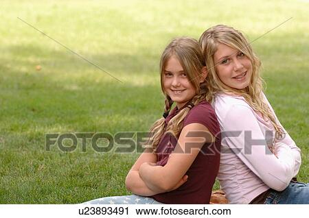 Portrait of young girls on grass, Regina, Saskatchewan View Large Photo Image Stock Image - Portrait of young girls on grass, Regina, Saskatchewan. Fotosearch