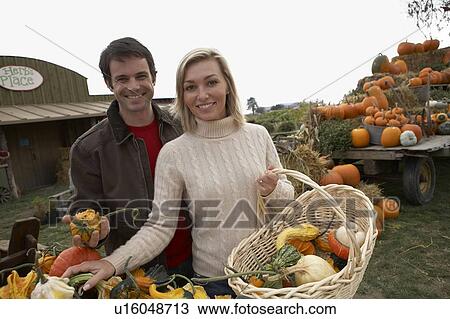 Couple looking at organic squash, Ladner, British Columbia, Canada View Large Photo Image Stock Image - Couple looking at organic squash, Ladner, British Columbia, Canada. Fotosearch