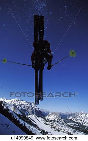 Young man catches big air while skiing at Fortress Mountain Resort, Alberta, Canada. View Large Photo Image Stock Photo - Young man catches big air while skiing at Fortress Mountain Resort, Alberta, Canada.. Fotosearch