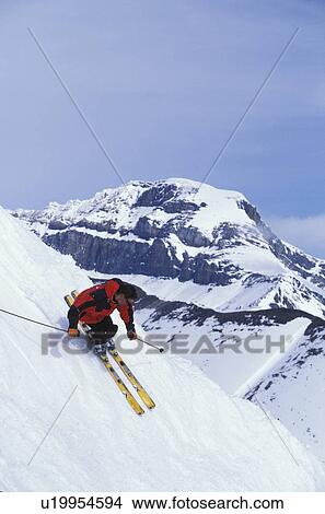 Young man skiing at Lake Louise Resort, Alberta, Canada. View Large Photo Image Picture - Young man skiing at Lake Louise Resort, Alberta, Canada.. Fotosearch