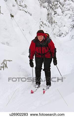 Young man skiing untracked slope at Castle Mountain Resort, Alberta, Canada View Large Photo Image Stock Image - Young man skiing untracked slope at Castle Mountain Resort, Alberta, Canada. Fotosearch