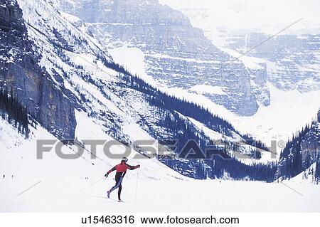 Young woman cross country skiing on Lake Louise, Banff National Park, Alberta, Canada View Large Photo Image Stock Photograph - Young woman cross country skiing on Lake Louise, Banff National Park, Alberta, Canada. Fotosearch