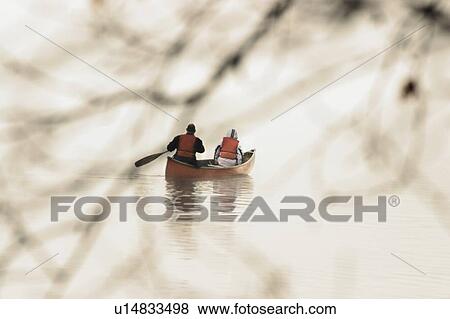 Stock Photo - Canoeists In Algonquin park. Ontario.. Fotosearch