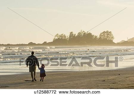 Father & daughter walk along beach, Chesterman Beach near Tofino, Vancouver Island, British Columbia, Canada View Large Photo Image Stock Image - Father & daughter walk along beach, Chesterman Beach near Tofino, Vancouver Island, British Columbia, Canada. Fotosearch
