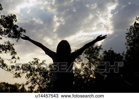 Girl with arms upstretched toward sunset, Assiniboine Park, Winnipeg, Canada View Large Photo Image Stock Image - Girl with arms upstretched toward sunset, Assiniboine Park, Winnipeg, Canada. Fotosearch