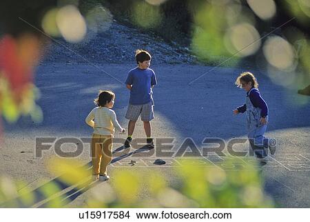 Picture - Kids playing hopscotch in autumn, Whistler, BC Canada. Fotosearch