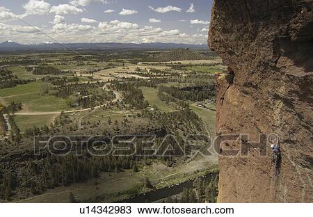 Man climbing the Monkey Face in Smith Rock State Park, Oregon View Large Photo Image Stock Image - Man climbing the Monkey Face in Smith Rock State Park, Oregon. Fotosearch