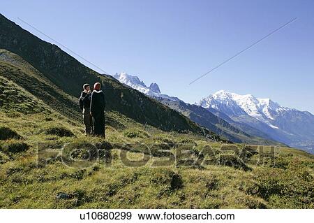 Young girls (19) hiking in front of Mont Blanc, Col de Balme Chamonix, France View Large Photo Image Stock Photo - Young girls (19) hiking in front of Mont Blanc, Col de Balme Chamonix, France. Fotosearch