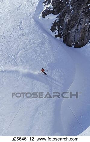 Young man skiing on ungroomed slope near Fortress Mountain, Alberta, Canada. View Large Photo Image Stock Image - Young man skiing on ungroomed slope near Fortress Mountain, Alberta, Canada.. Fotosearch