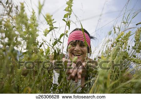 Young woman (19) in alpine meadow, Servoz, Haute Savoie, France View Large Photo Image Stock Photo - Young woman (19) in alpine meadow, Servoz, Haute Savoie, France. Fotosearch